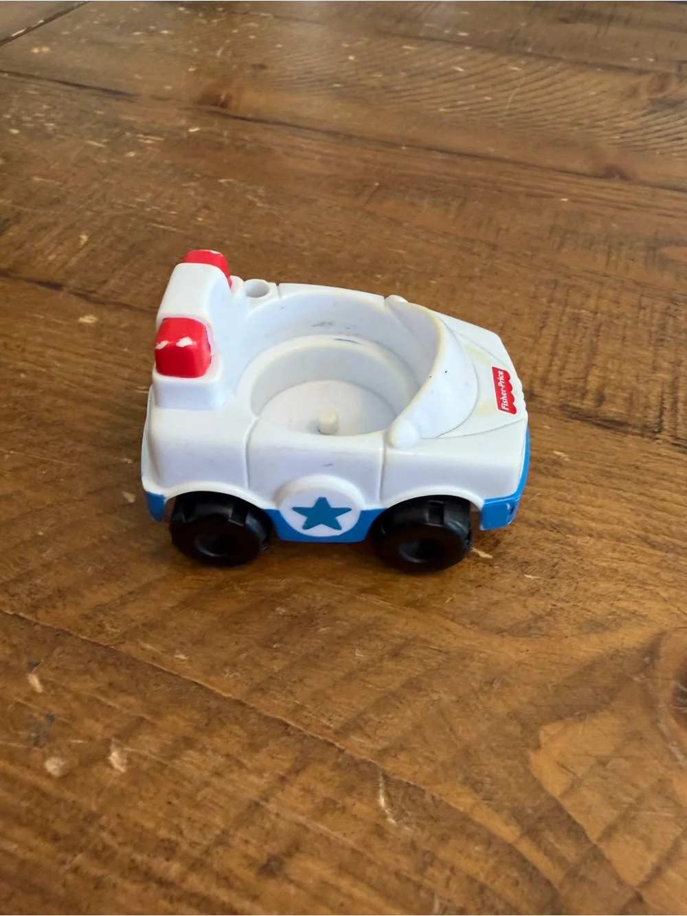 Fisher Price Little People police car as is. Has areas of yellowing see pictures